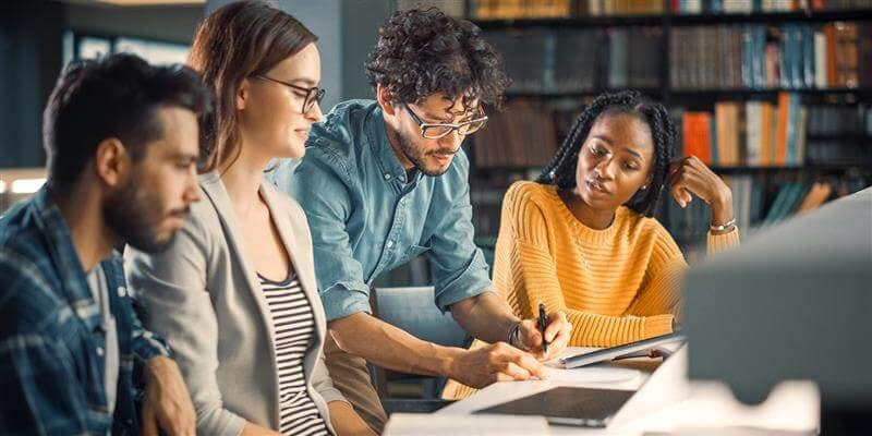 A group of students working in a library