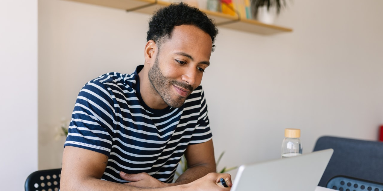 Teacher writing in a notebook