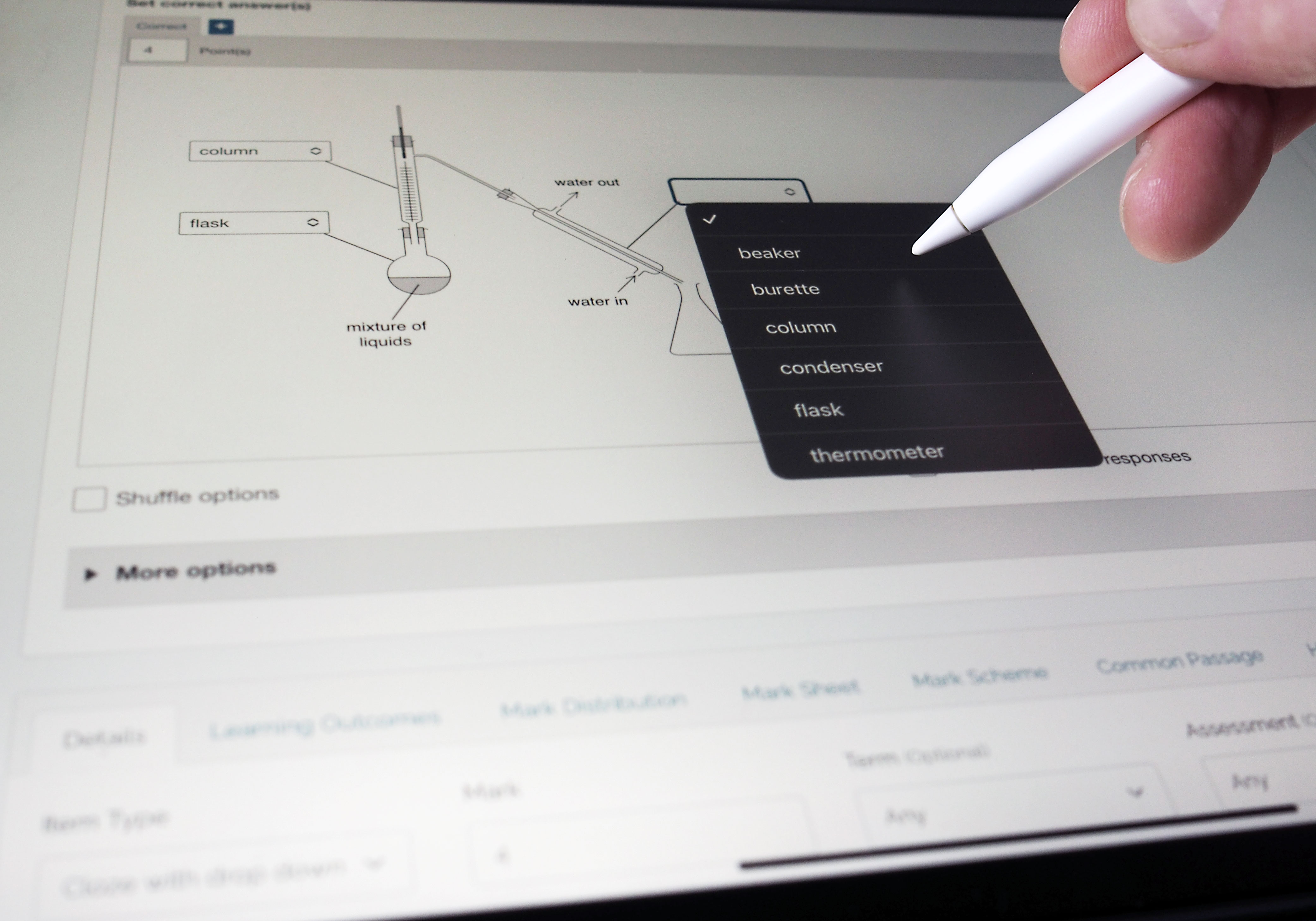 Stylus selecting a dropdown menu option on a tablet during a digital assessment
