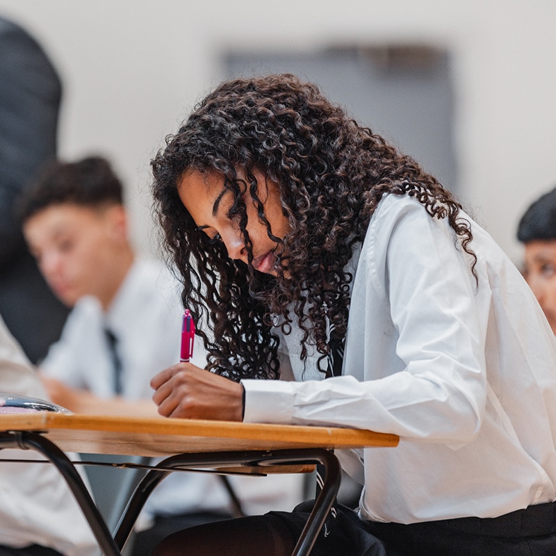 teenage girl sitting an exam 