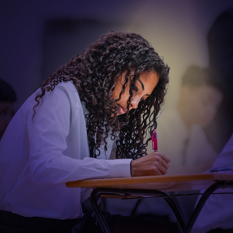 teenage girl sitting an exam 
