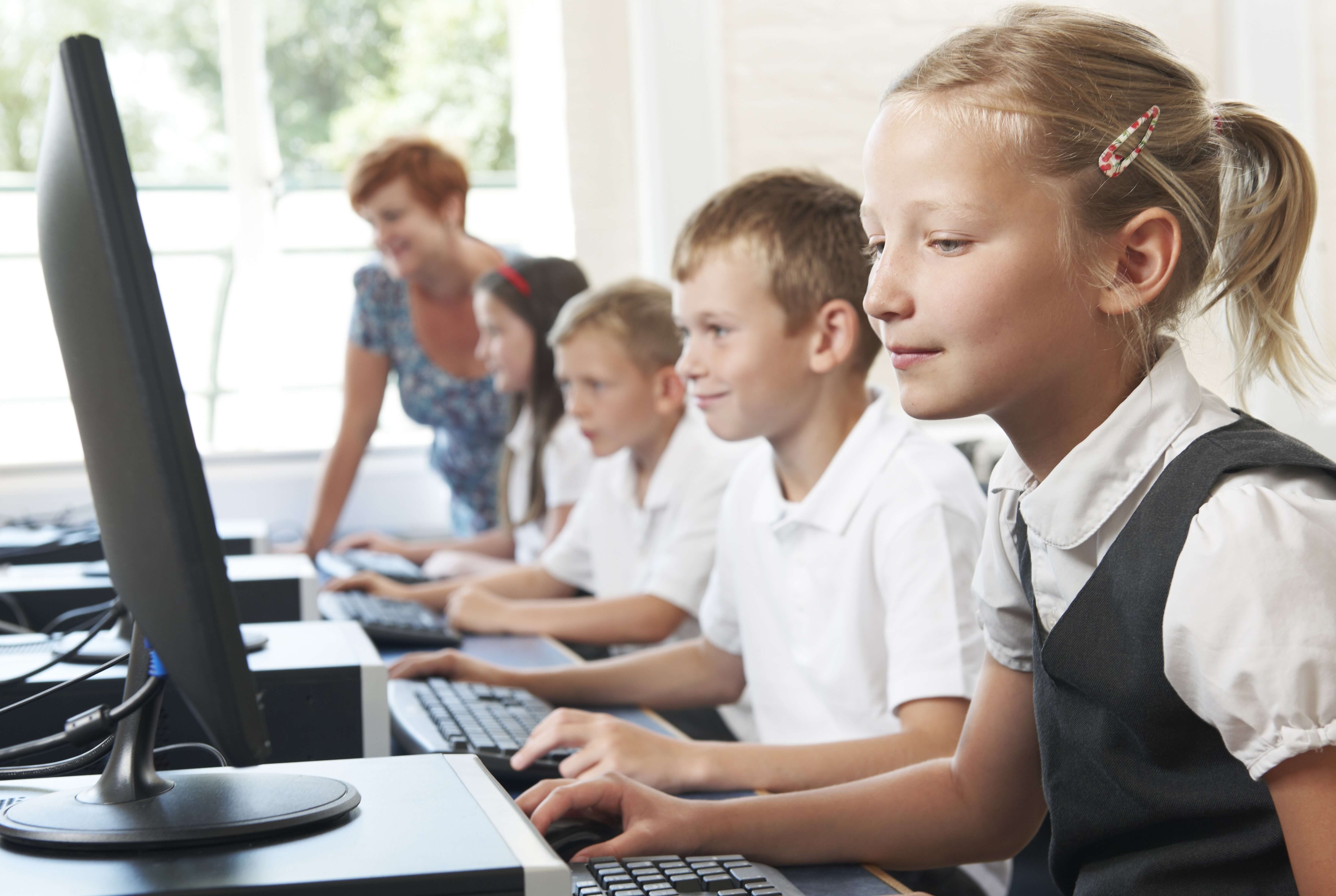 Pupils working on computers in a classroom