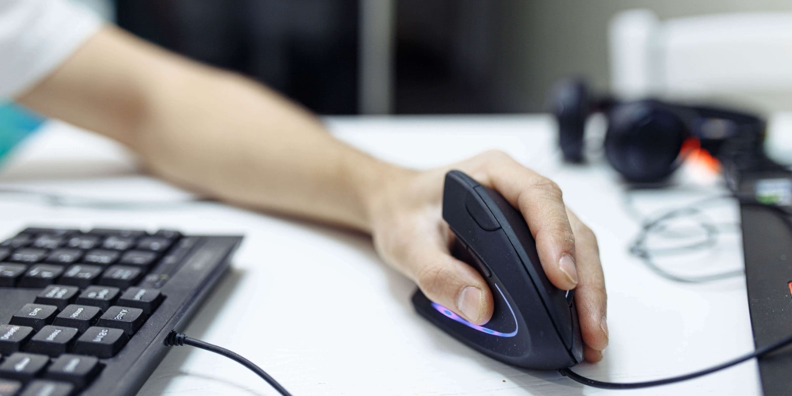 Hand on computer mouse