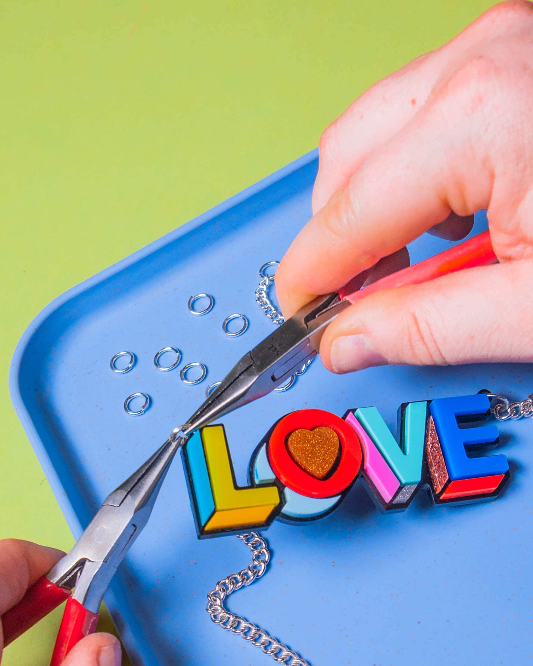 Pair of hands that are jewellery making