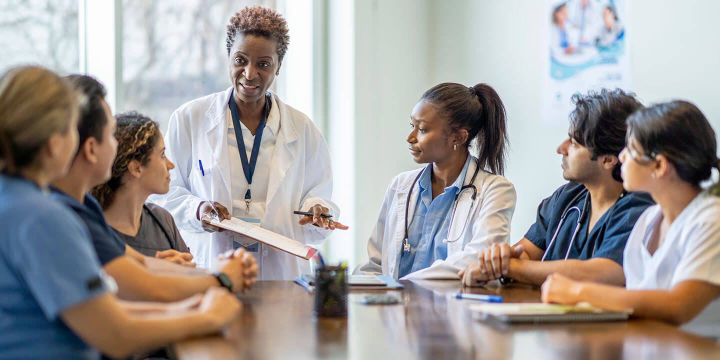 Nursing students listening to an educator