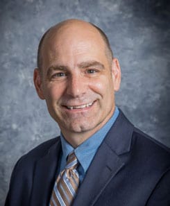 Headshot of John Holcomb, Professor and Vice Provost for Academic Programs at Cleveland State University. 