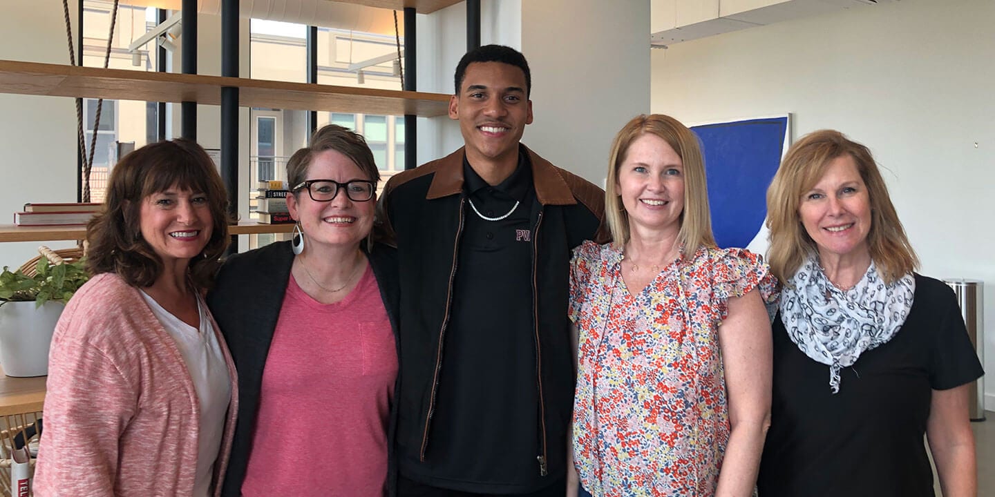 Blog author Ryan standing with 4 Pearson Campus Ambassador program managers, 2 on each side.