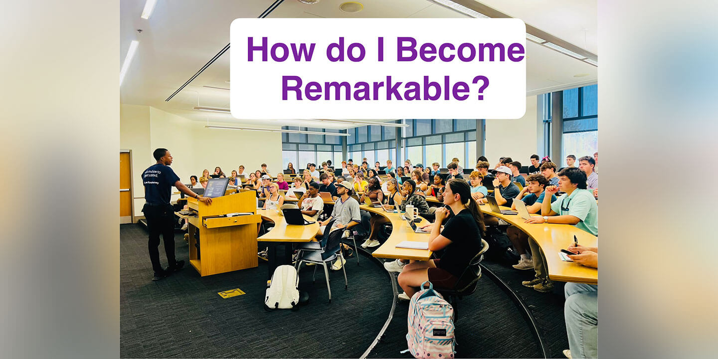 The Blog Author, Royale, is standing in front of a room full of students in a lecture hall.