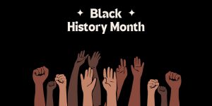 A digitally produced graphic with the text ‘Black History Month’ above several raised hands of varying skin tones against a black background.