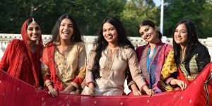 A group of 5 college women wearing traditional Bengali attire.