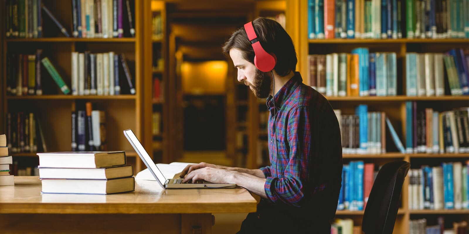 Man studying in a college library