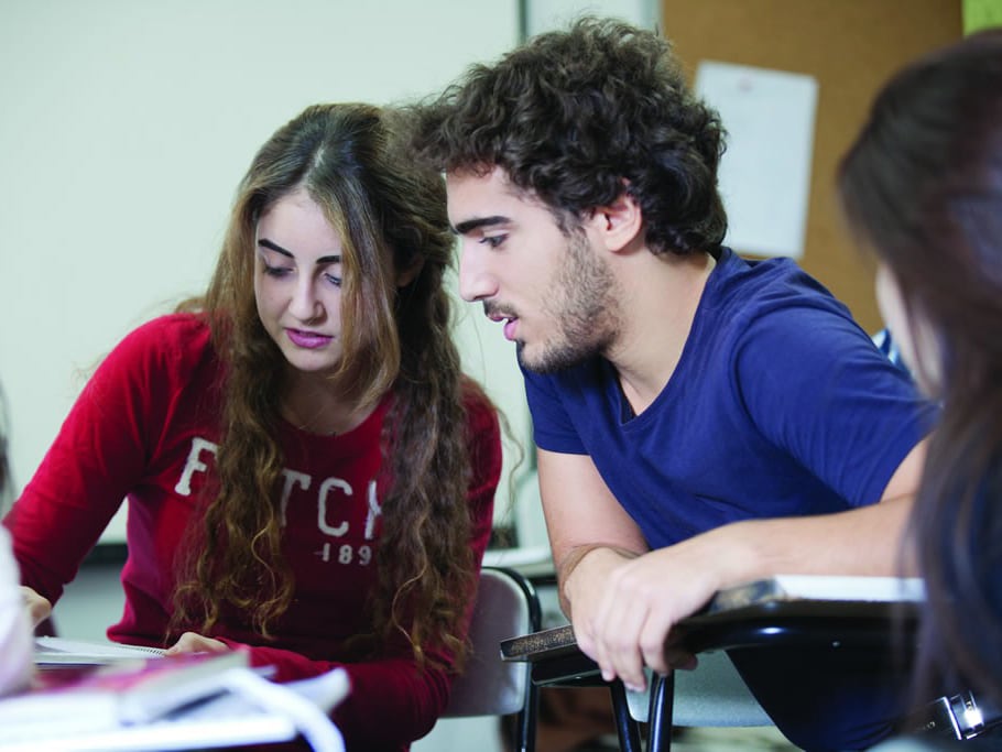 Two students studying together in classroom