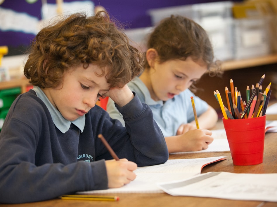 Primary boy and and girl in classroom