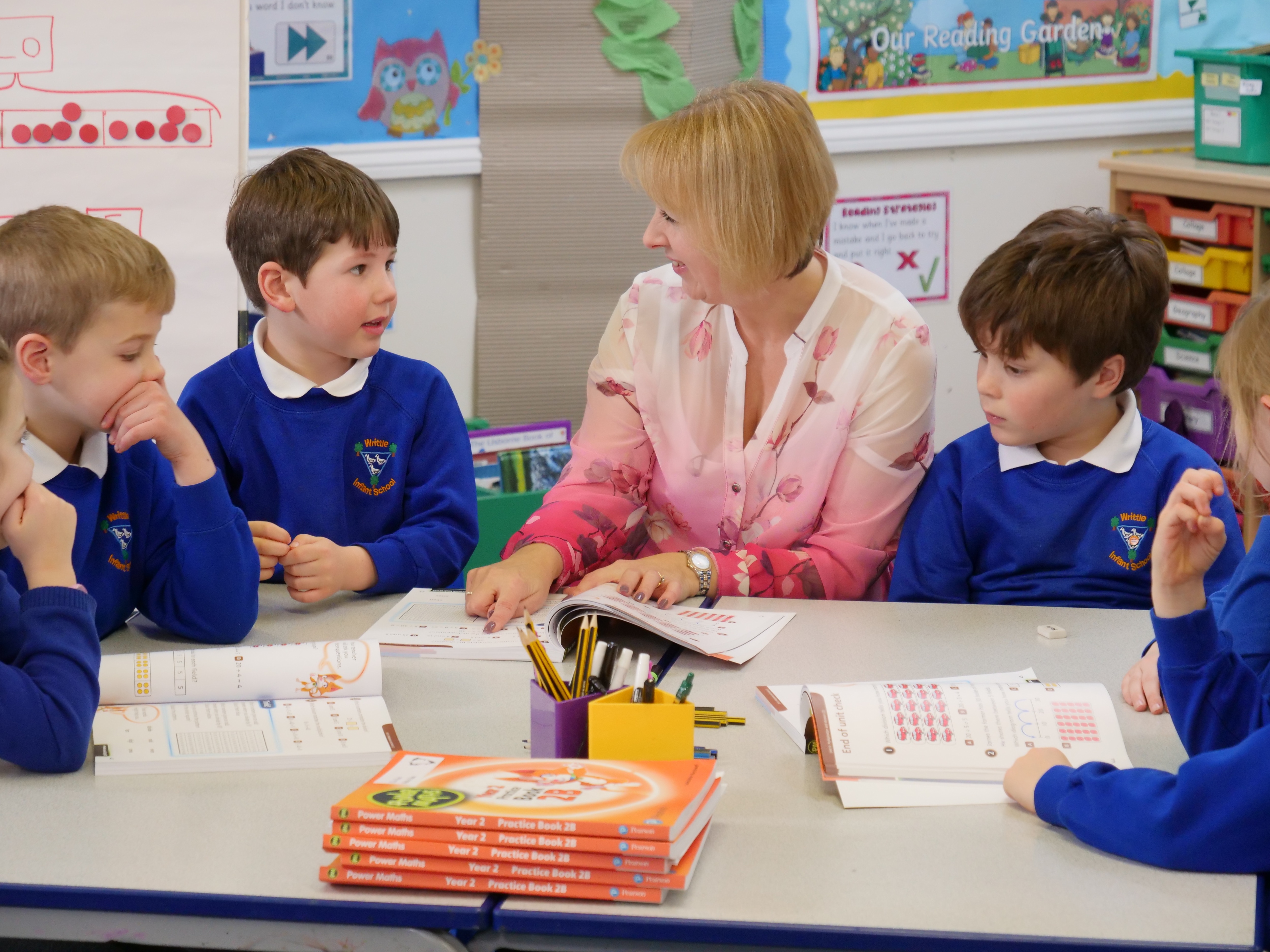 Teacher and children in classroom.