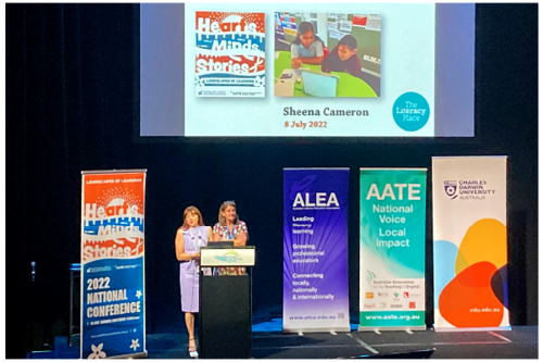 Sheena Cameron on stage delivering her keynote at the 2022 AATE/ALEA conference.