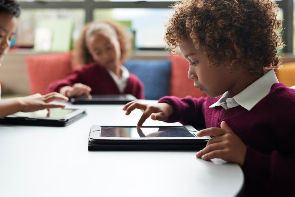 Image of children using tablets