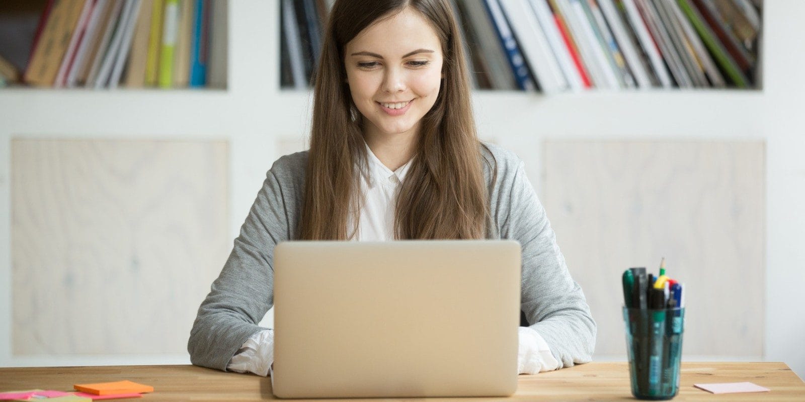 Student looking at her laptop
