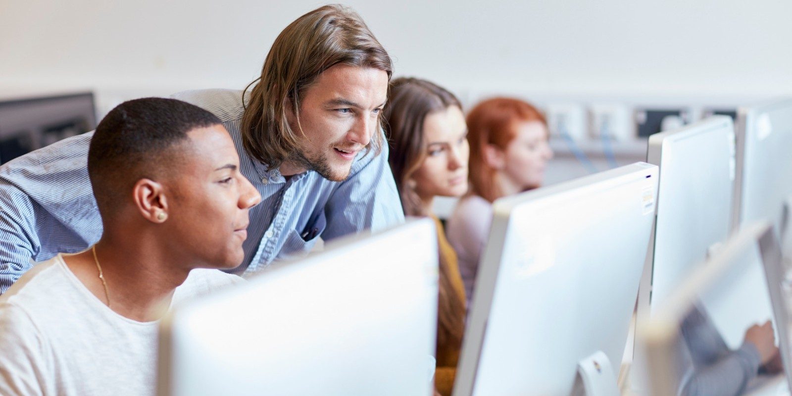 Students looking at computer screen