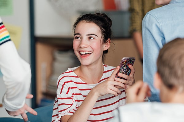 happy girl using phone
