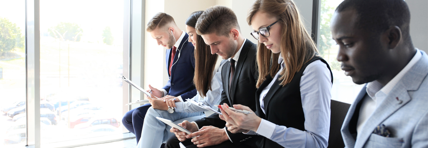 Business people sat and waiting in a row