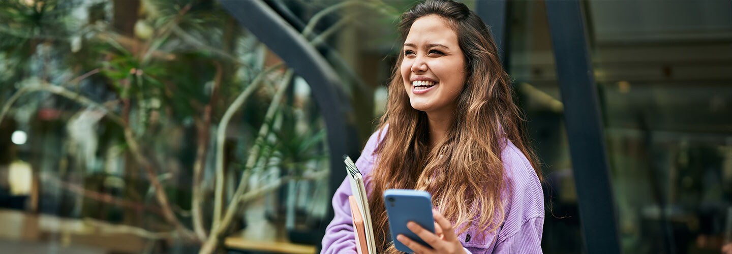 Woman laughing, on phone