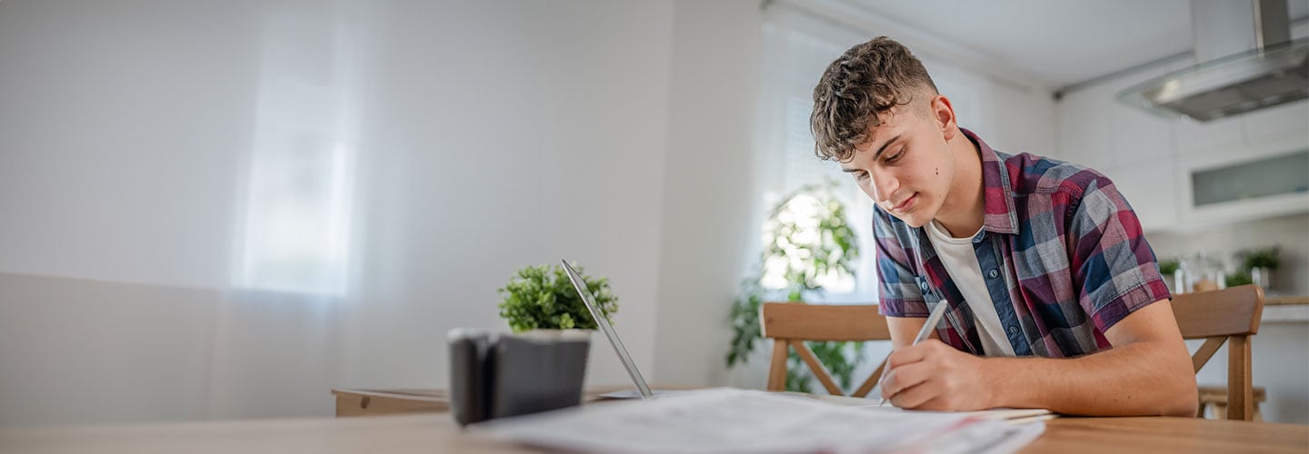 Male student writing