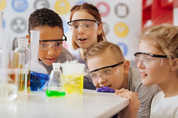 Excited  kids exploring lab science