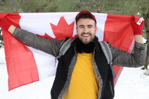 Happy man with Canadian flag