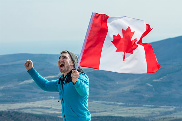 Happy man with Canadian flag