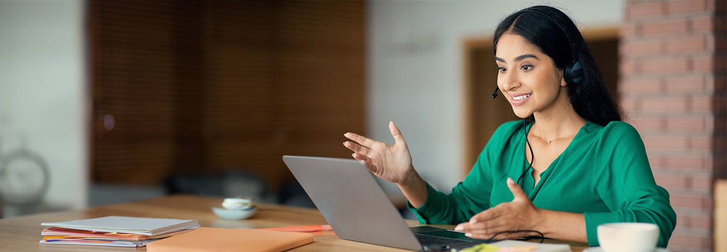 A woman having an online meeting in the office