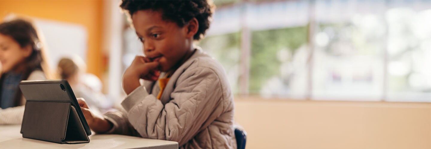 Young pupil using tablet