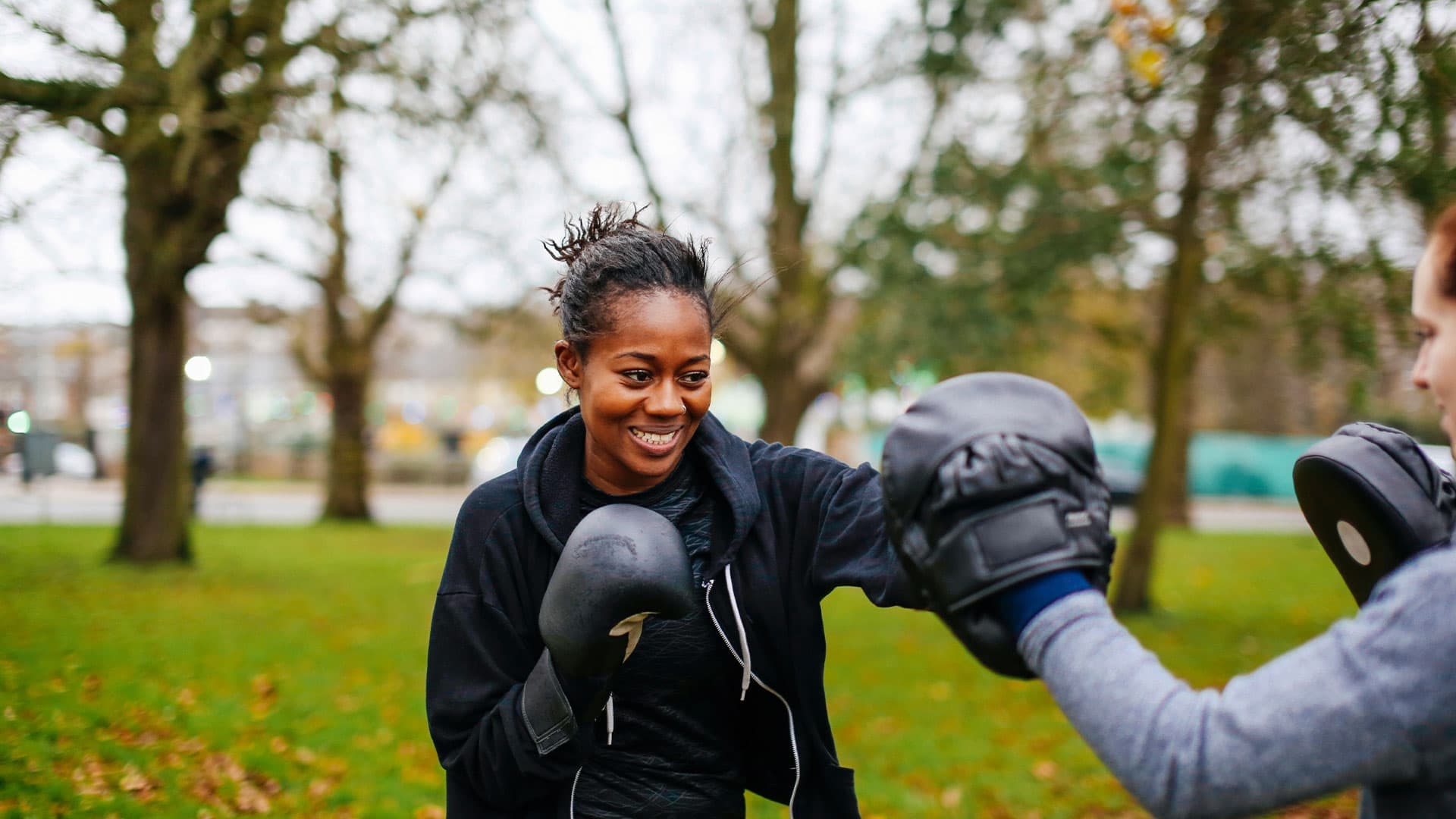 Women boxing in the park