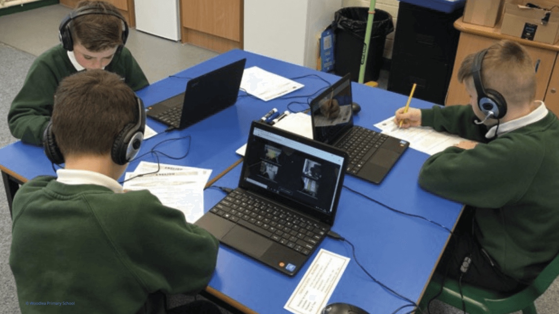 pupils studying on laptops